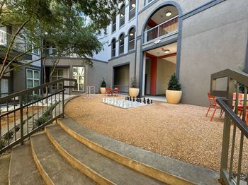 Courtyard with a chess board and chairs